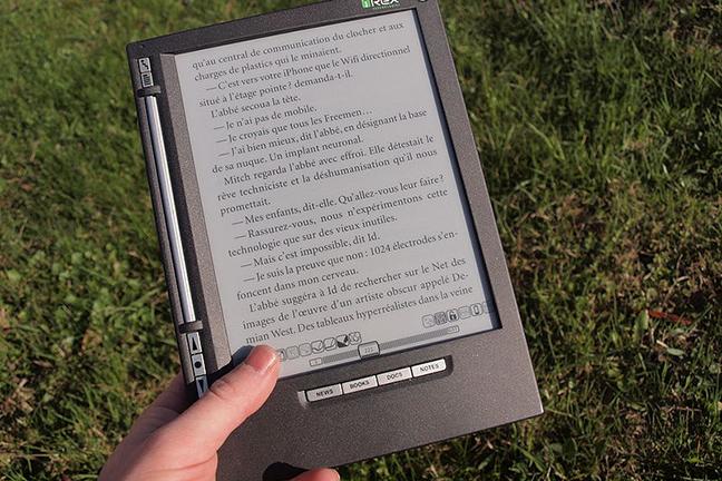 Photograph of hand holding an ebook reader