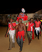 men carrying an artefact during an initiation ritual in Gabon image small